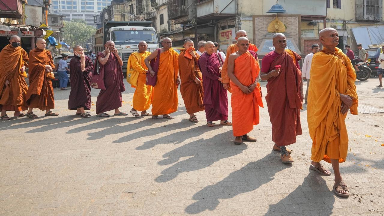 Hundreds of Buddhist monks took out a rally in Worli suburb of central Mumbai on Friday, a day before 'Dhamma Diksha', an international conference on Buddhism