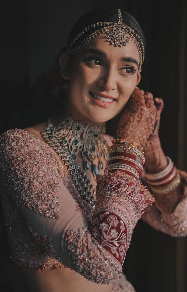 Mukti Mohan looked a million bucks in a pastel pink lehenga with a hint of red and emerald