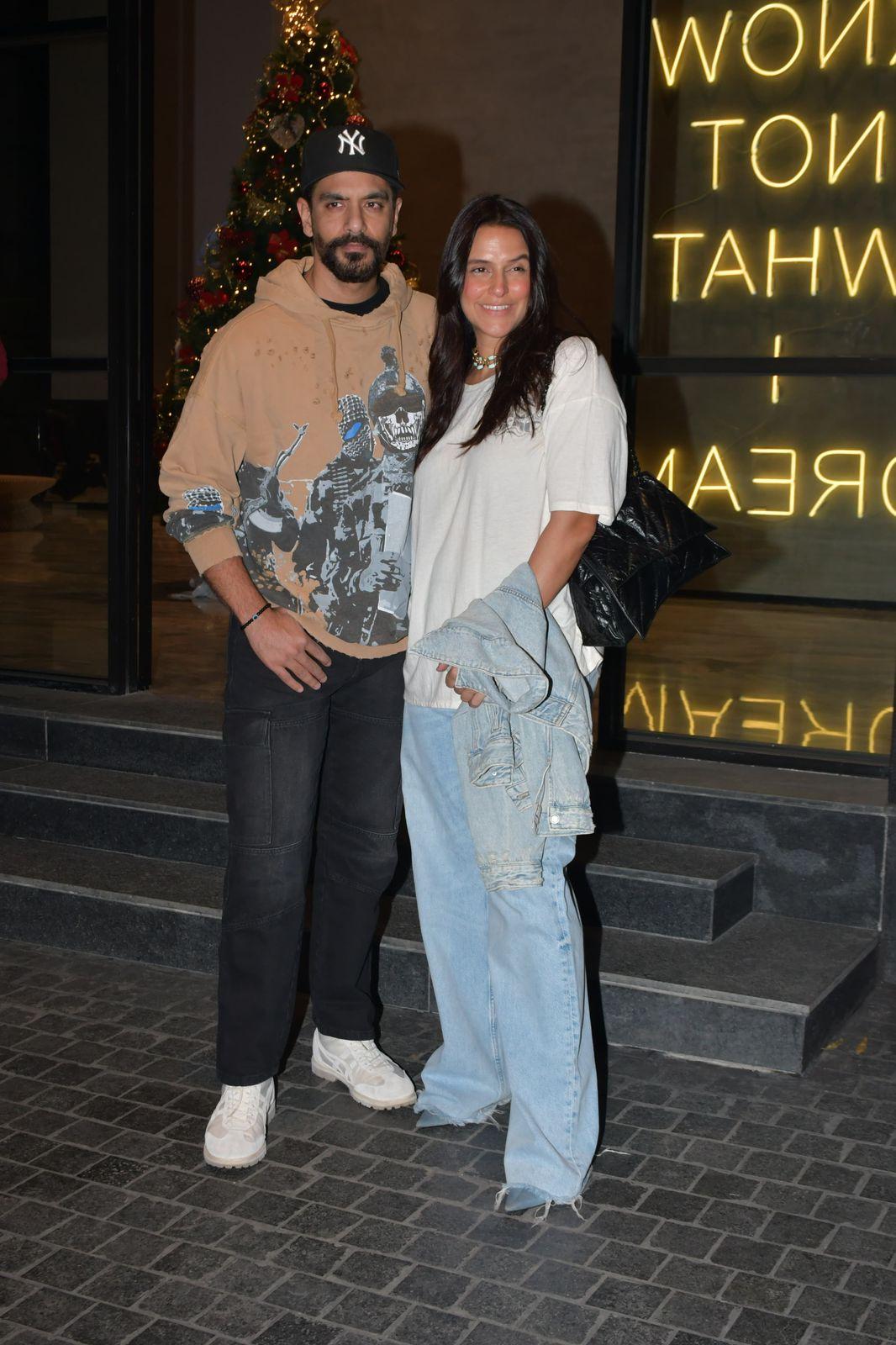 Neha Dhupia and Angad Bedi were all smiles as they posed for the paparazzi