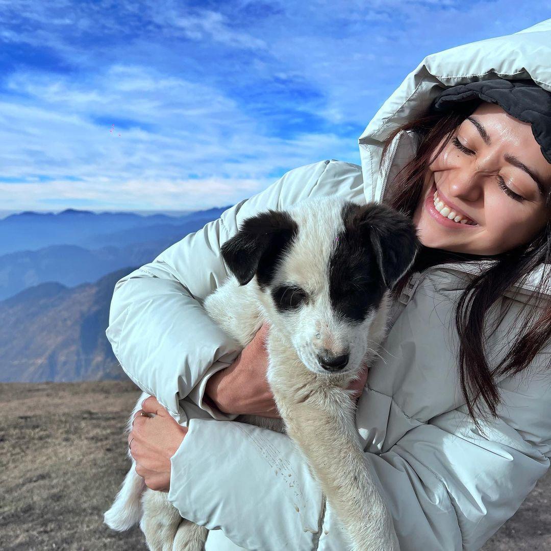 Asha posted photos of her playing with some cute mountain dogs, looking all adorable in a fluffy white jacket