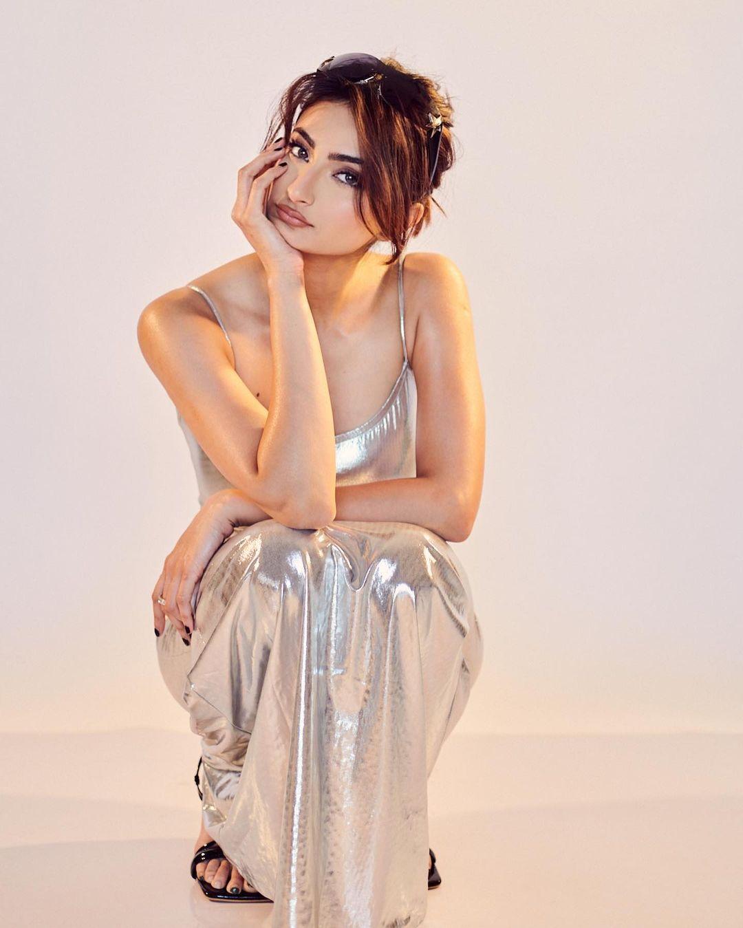 Palak styled this maxi metallic dress with a simple messy bun that gave the ensemble the right amount of flair