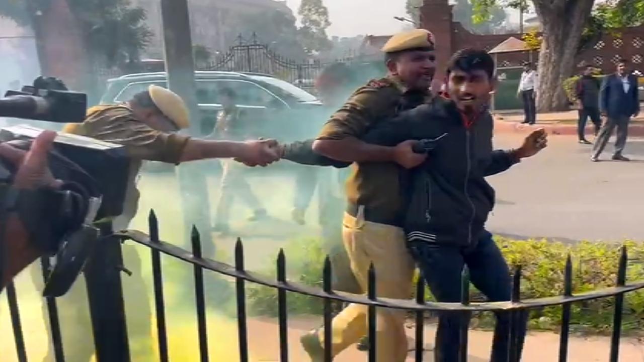 On the anniversary of the 2001 Parliament terror attack, chaos ensued in the Lok Sabha today on Wednesday as two individuals breached security, entered the chamber during Zero Hour, and released yellow gas from canisters. Simultaneously, two others, including a woman, protested outside the Parliament premises, spraying colored gas and shouting slogans