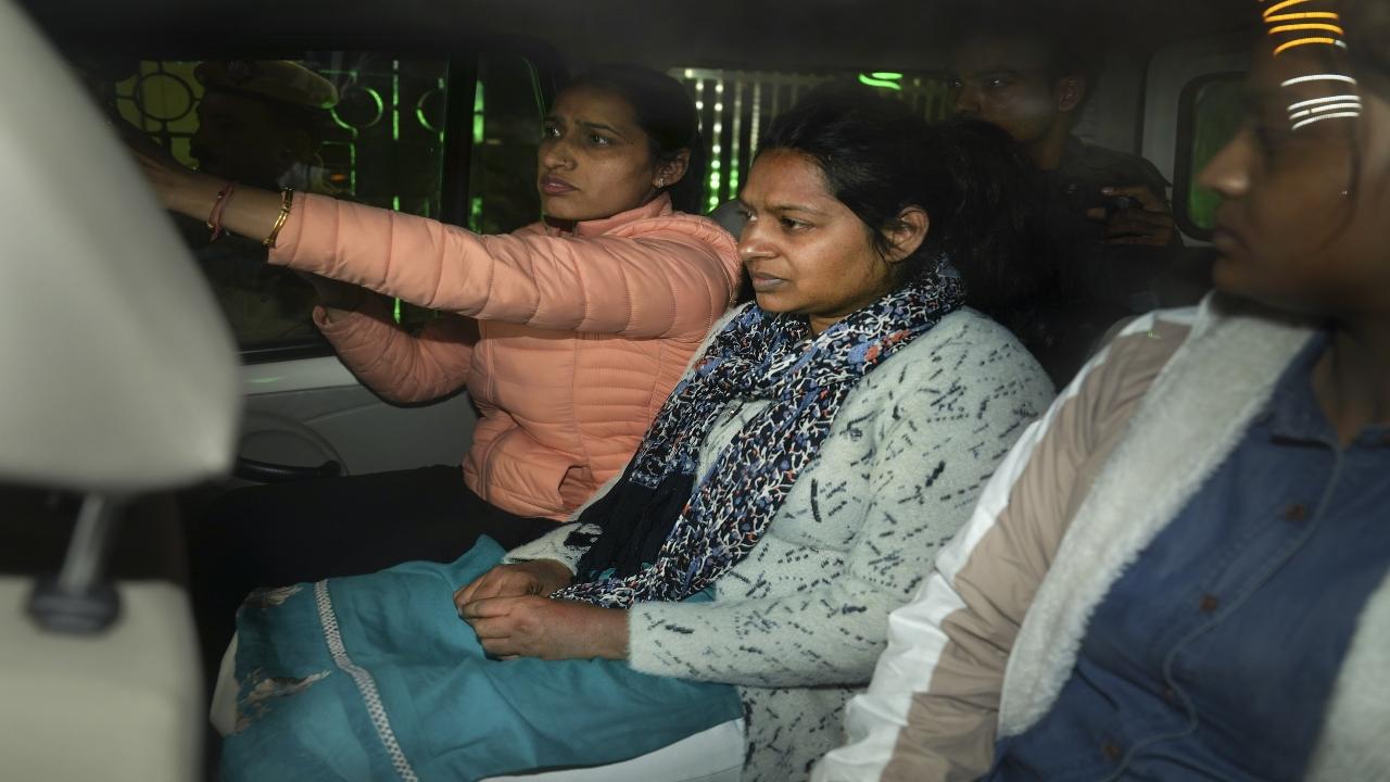Four persons arrested in connection with the security breach in Parliament have been charged under the anti-terror law UAPA besides sections of the Indian Penal Code, police sources said on Thursday as security agencies were on the hunt to nab the alleged mastermind.
