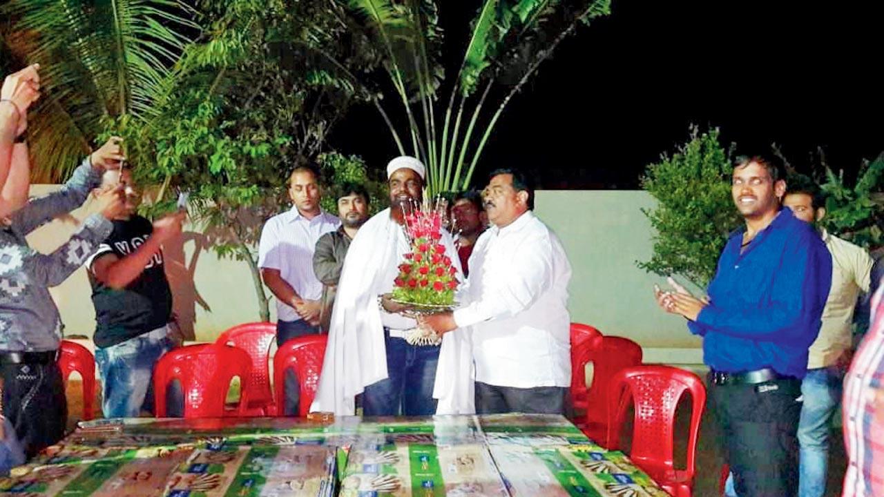 Stills from the video that purportedly shows Shiv Sena (UBT) leader Sudhakar Badgujar interacting with convict Salim Kutta