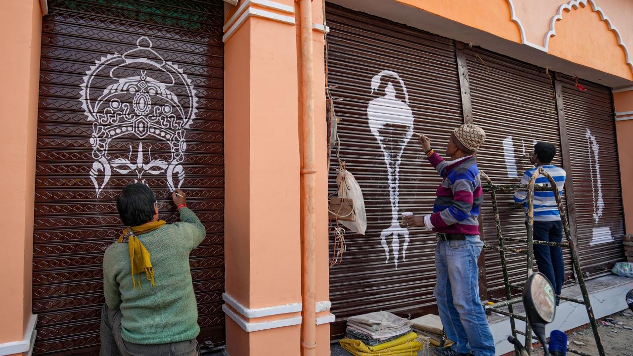 Artworks on shutters of shops located along Ram Path include a temple silhouette with a chant 'Jai Shri Ram', Swastika symbol, images of a conch, a mace, or 'Shri Ram' written in Hindi in a calligraphic style, a fluttering saffron flag, a Sun, bow and arrow, and images of 'tilak' as sported by followers of different sects of Hinduism