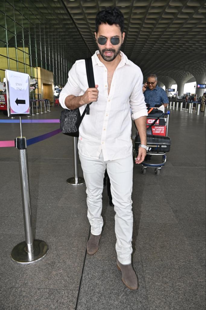 Varun Dhawan opted for an all-white outfit for his airport look as he jets off