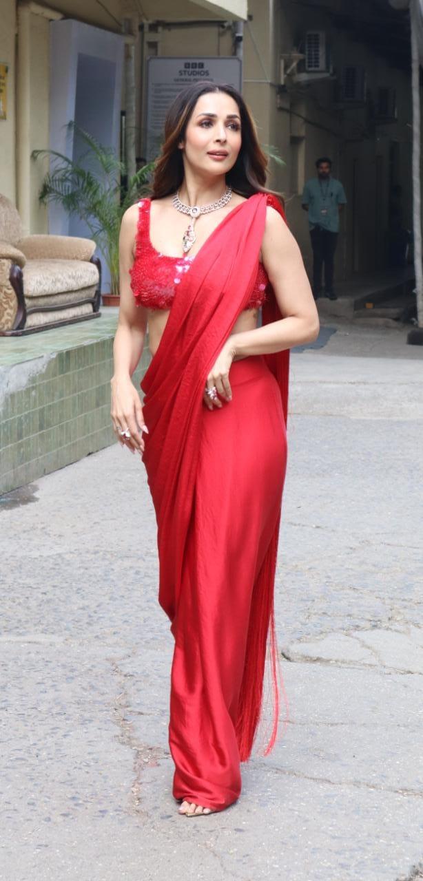 Malaika Arora was clicked at the sets of 'Jhalak Dikhla Ja'. The actress opted for a plain red saree and paired it with matching sequin blouse