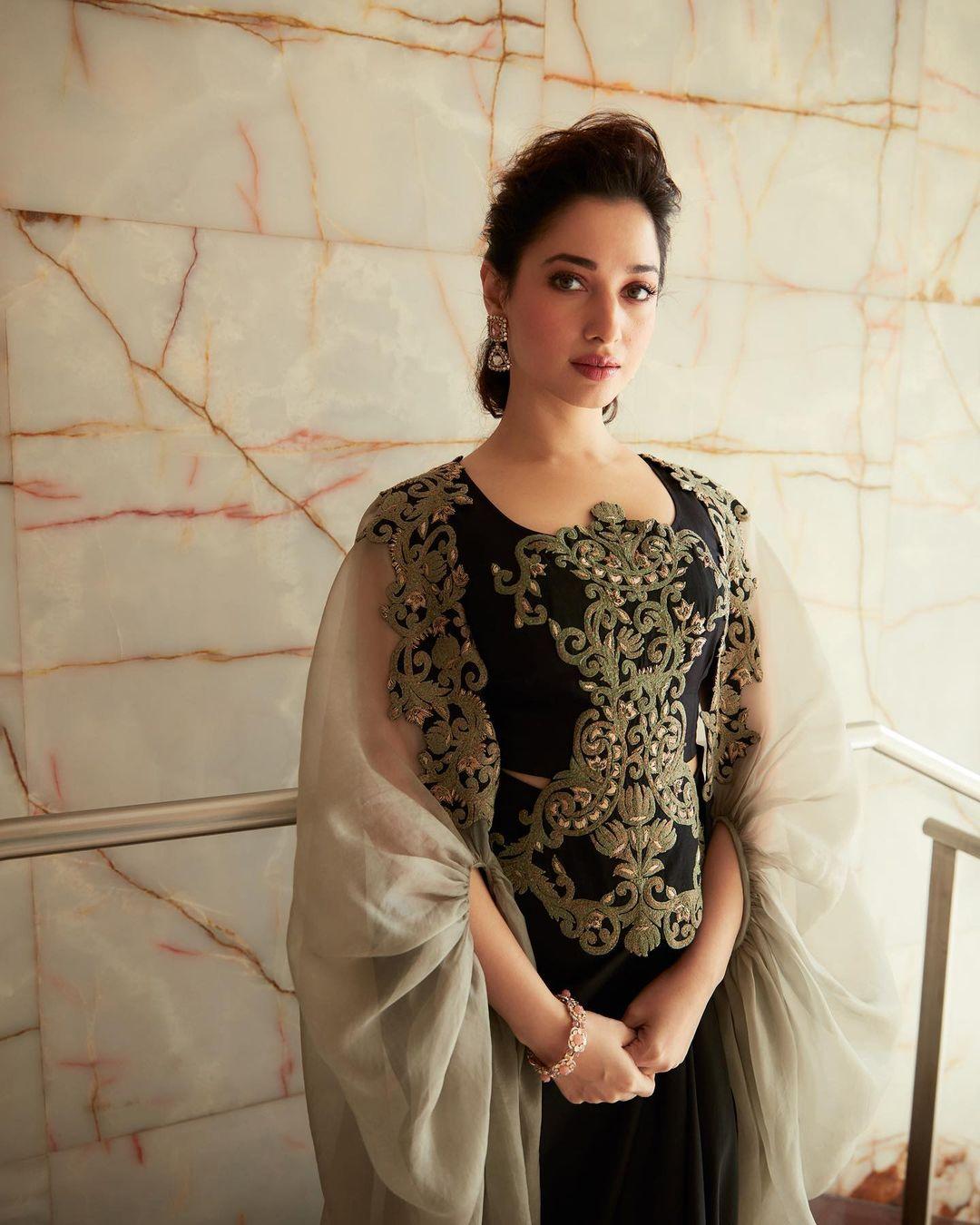 Tamannaah Bhatia absolutely rocked a blend of Indian and Western styles with her outfit. The ensemble stood out with beautiful threadwork that enhanced the overall look of the otherwise monochromatic outfit.