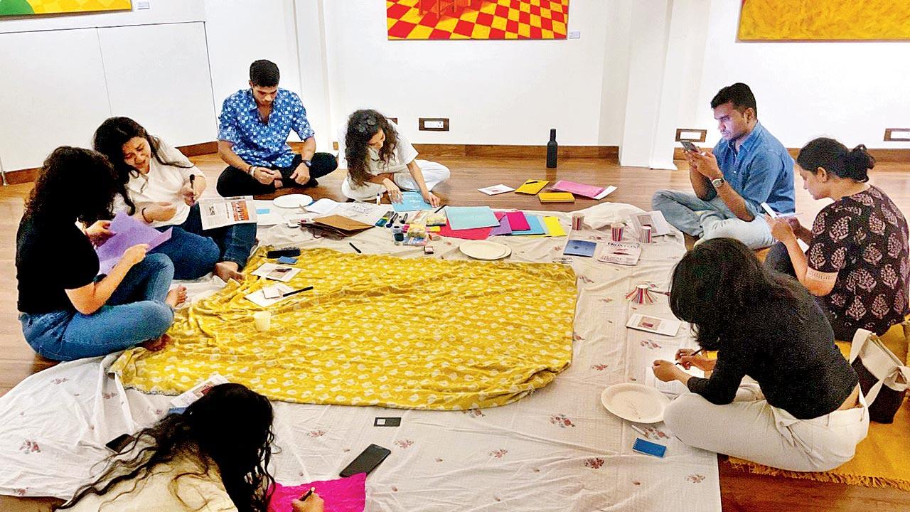 Participants craft origami poetry at a previous session