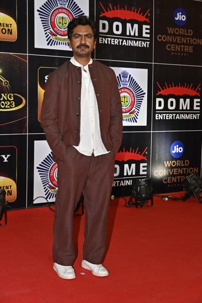 Nawazuddin Siddique wore brown pants and paired it with a white T-shirt and a matching jacket as he attended the grand police event Umang