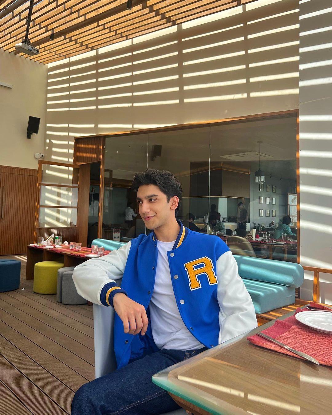 Sticking with a relaxed vibe, Vedang demonstrates how a varsity jacket can instantly elevate any outfit and make it ten times more stylish.