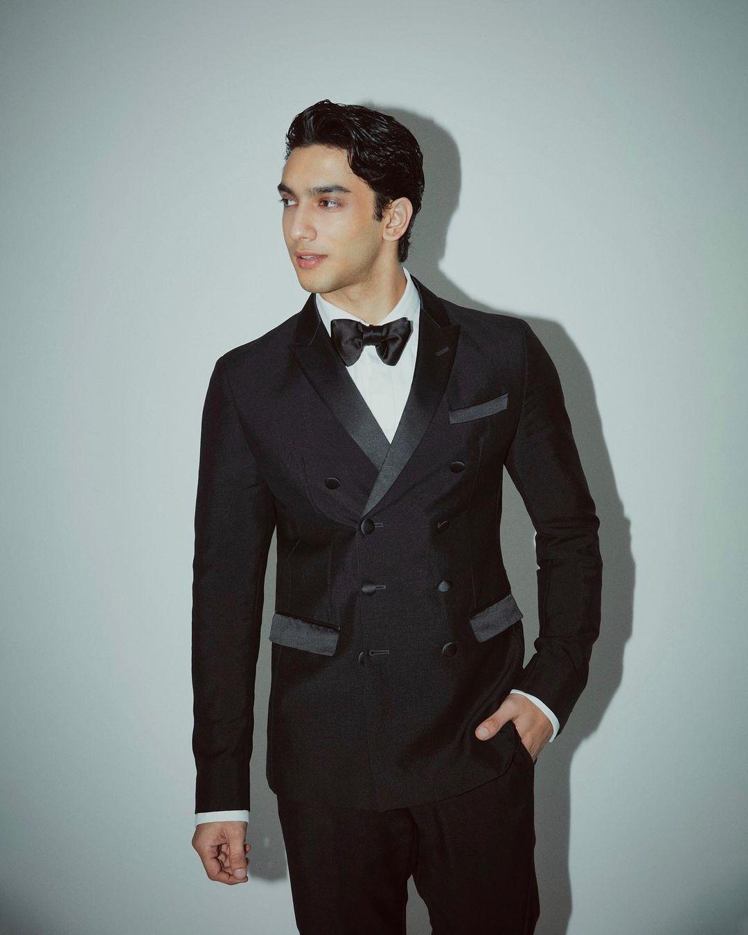 Vedang has mastered the art of donning a tuxedo flawlessly. Every detail is spot on: the bowtie is perfectly angled, the coat's seams are crisp and straight, and his trousers are impeccably tailored. The entire ensemble is a visual delight