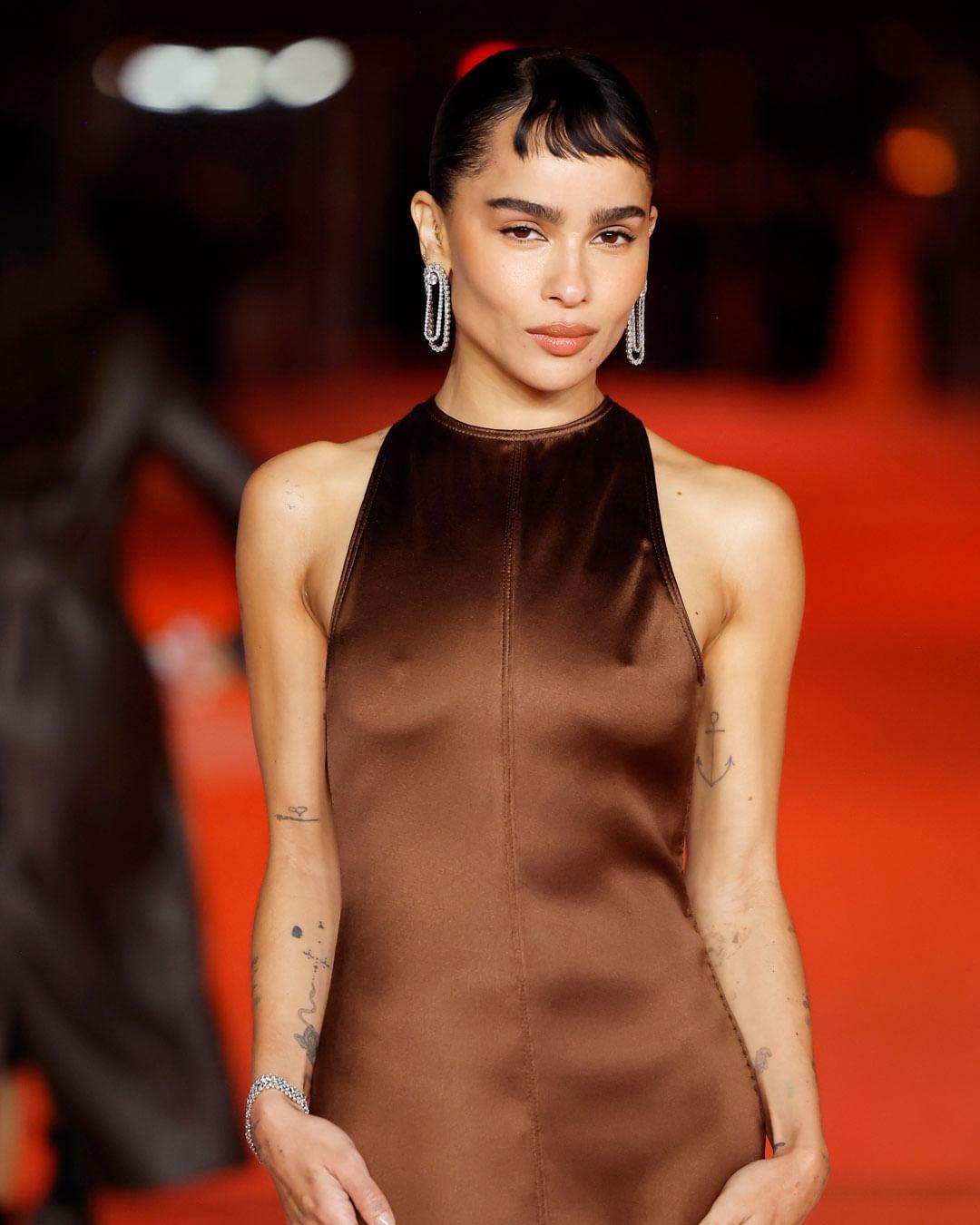 Zoe Kravitz kept things sleek in a brown silk dress by Saint Laurent