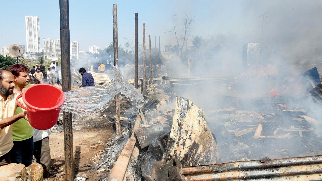The deceased was trapped in one of the hutments and had inhaled smoke. Pics/Sameer Markande