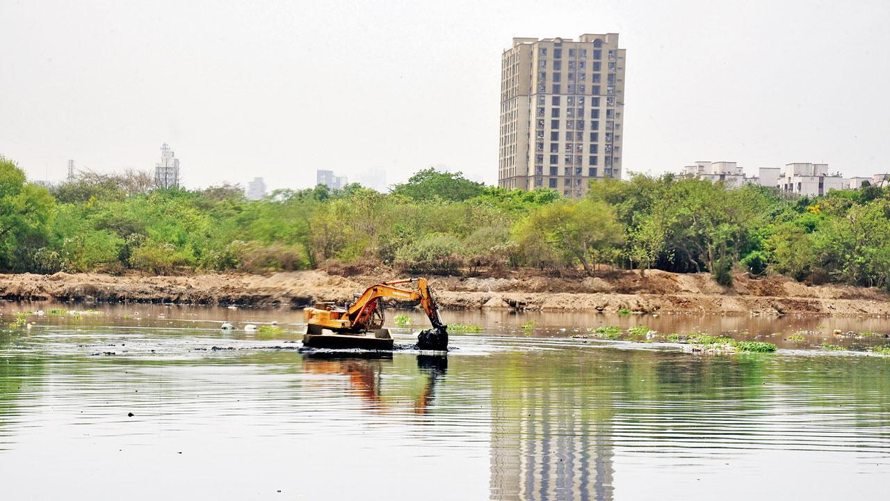 Cleaning work is on at Mithi river near Bandra. File pic
