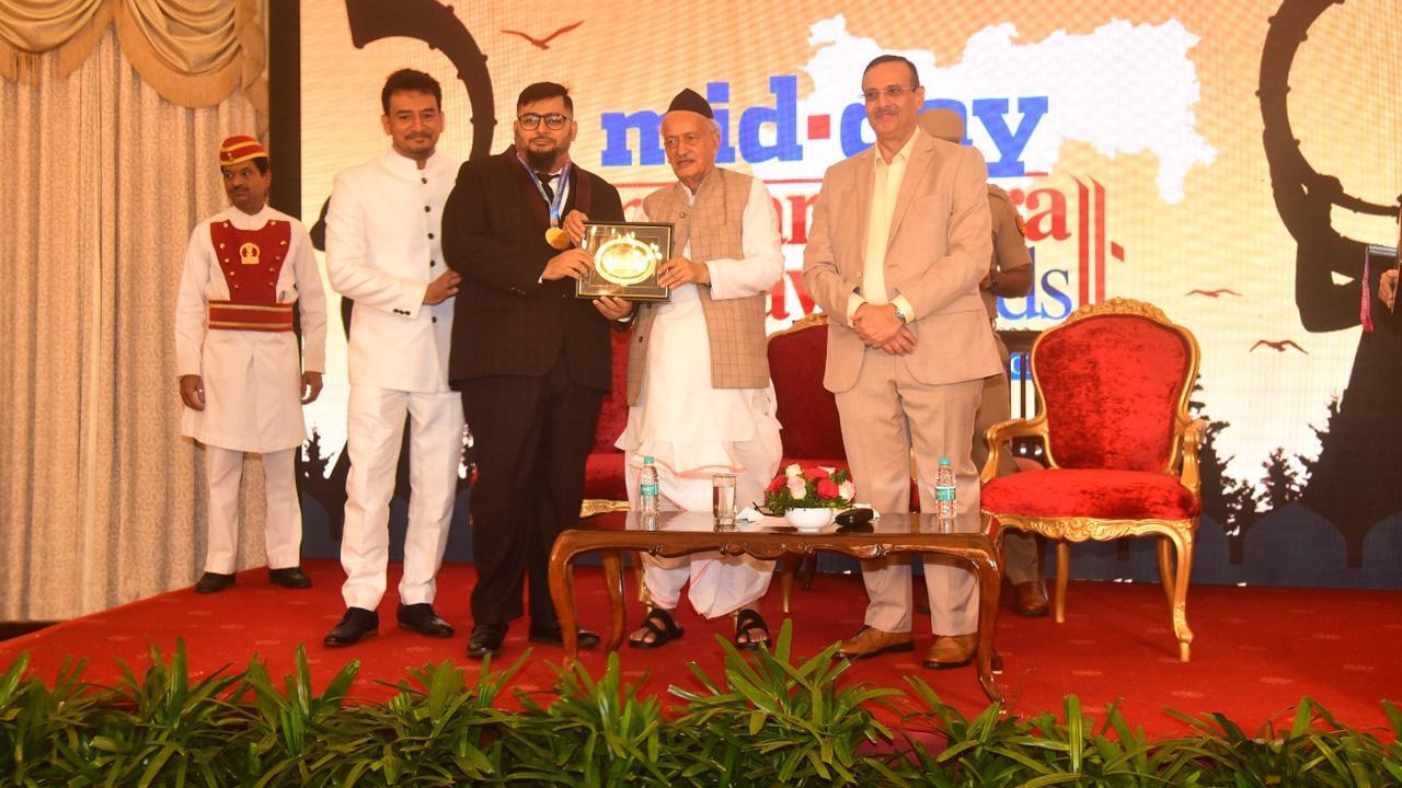 Governor Bagat Singh Koshyari awards Congress leader and social worker Mudassar Patel with 