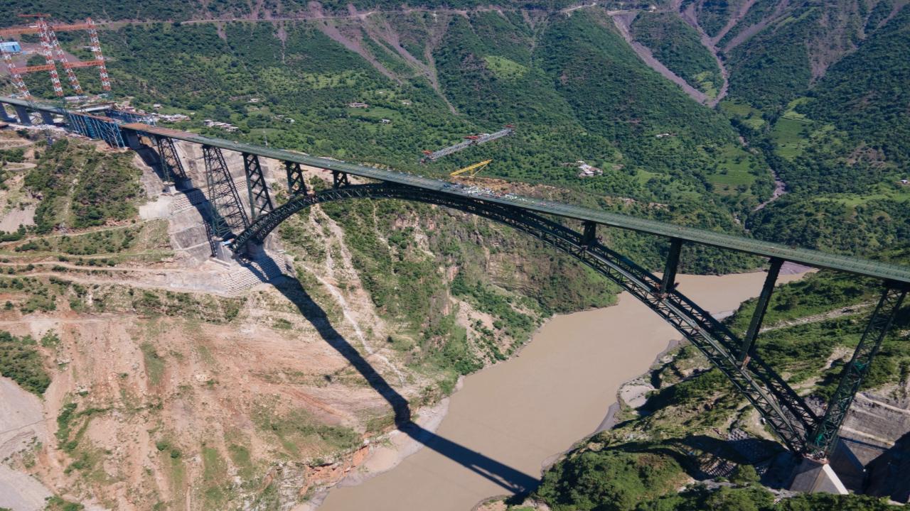 The track laying work commenced on Tuesday on the Chenab railway bridge, located 359 metres above the riverbed, in Reasi district of Jammu and Kashmir. The 1.3-kilometre-long bridge, which is 35 metres higher than the iconic Eiffel Tower in Paris, forms a crucial link in the 111-km stretch from Katra to Banihal, which is part of the Rs 21,653 crore Udhampur-Srinagar-Baramulla Railway Link (USBRL) project. Photo/Ministry of Railways Twitter