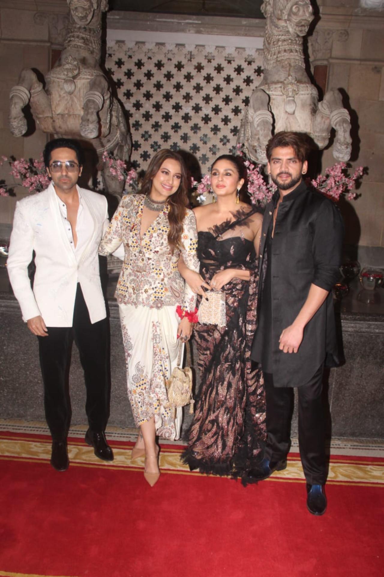 Sonakshi Sinha arrived with rumoured boyfriend and actor Zaheer Iqbal and close actor friend Huma Qureshi. Sonakshi looked stunning in a white printed outfit, while Sonakshi opted for a black saree ensemble. The trio also posed with Ayushmann Khurrana who gave major retro vibes with his outfit