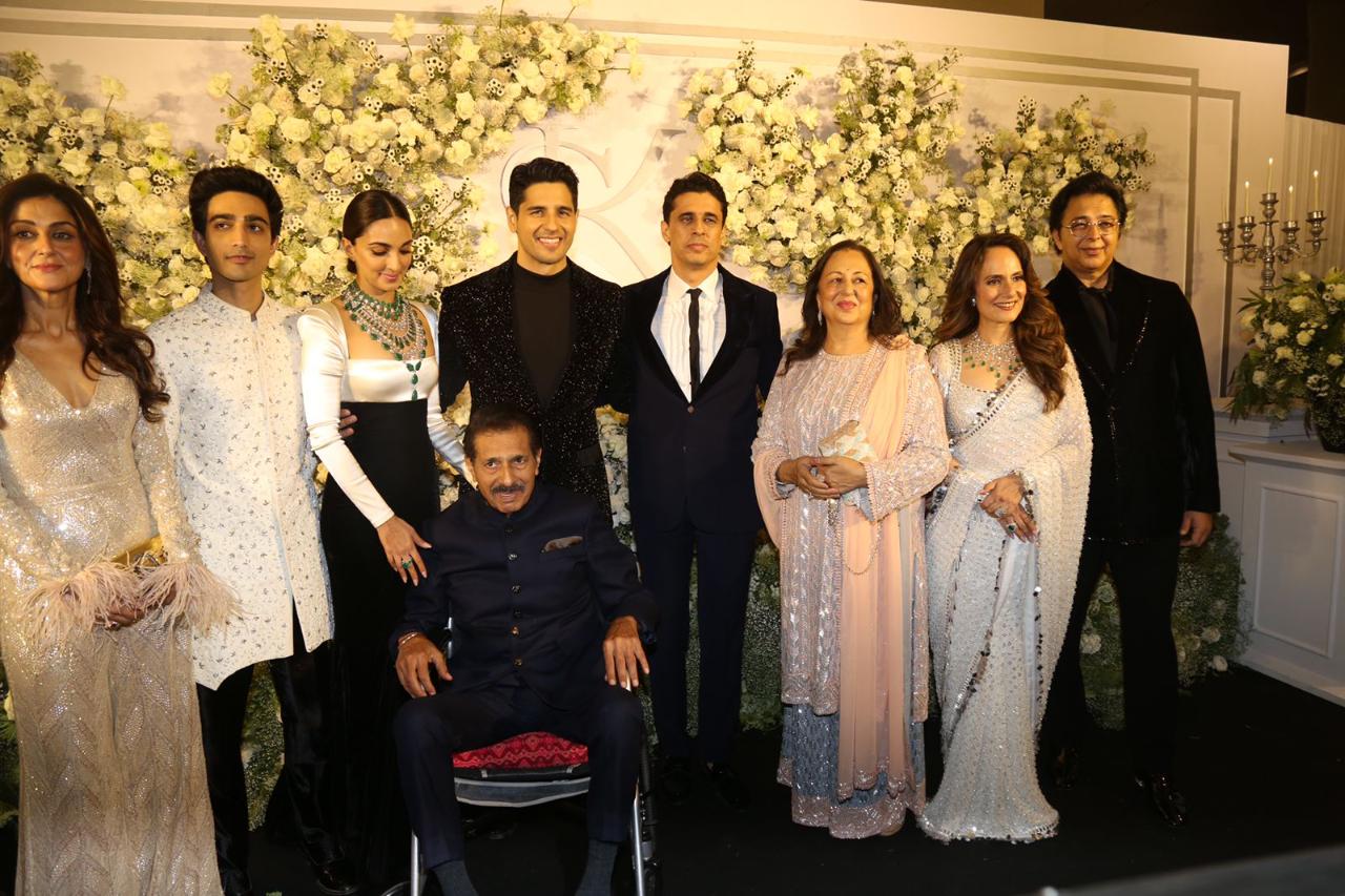 Sidharth and Kiara pose with their family members at their reception at St. Regis in Mumbai
