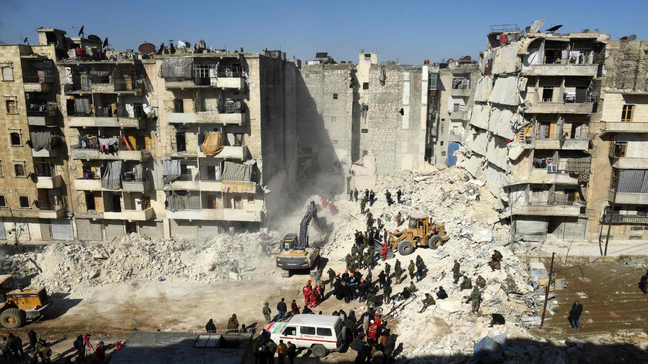Syrian soldiers look on as rescuers use heavy machinery sift through the rubble of a collapsed building in the northern city of Aleppo, searching for victims and survivors days after a deadly earthquake hit Turkey and Syria, on February 9, 2023. - The 7.8-magnitude quake early on February 6 has killed more than 17,000 people in Turkey and war-ravaged Syria, according to officials and medics in the two countries, flattening entire neighbourhoods. Photo/AFP