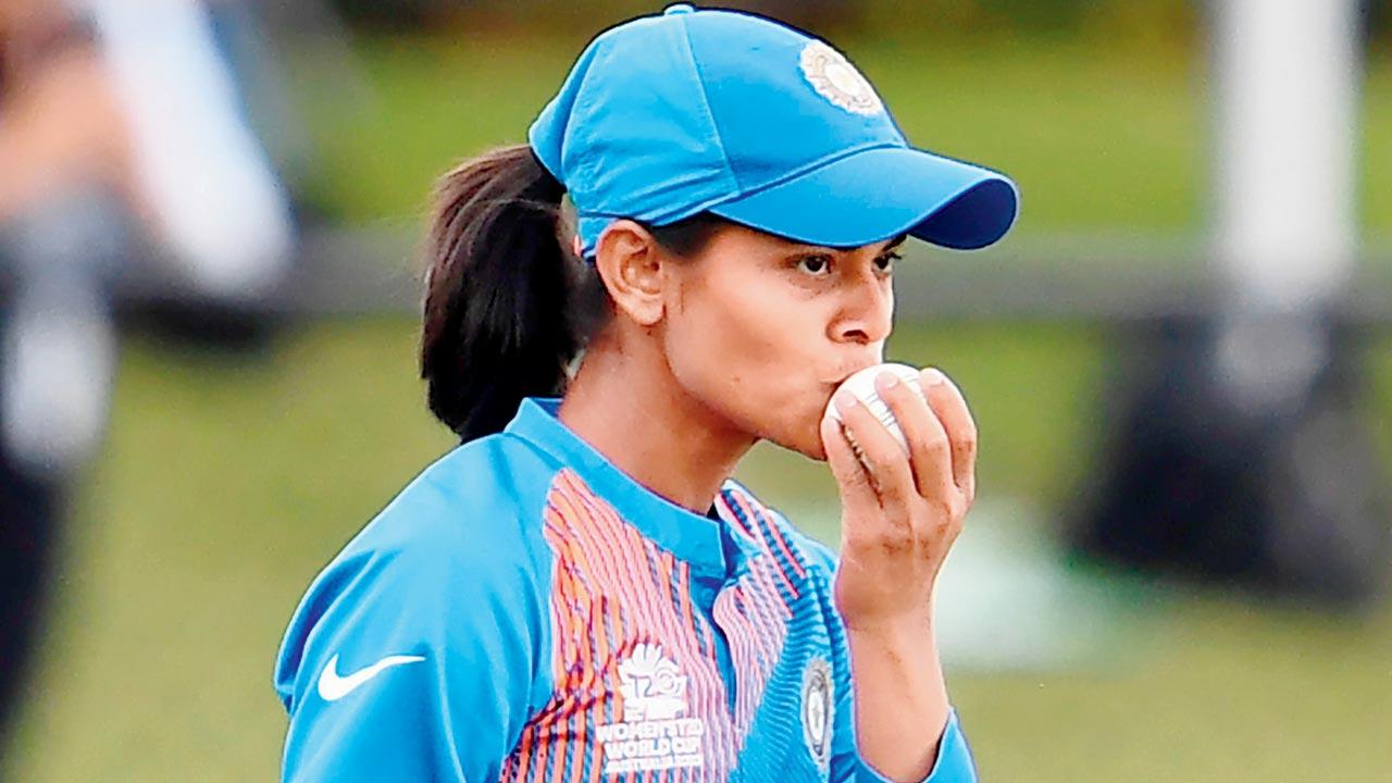 In this file pic, Radha Yadav kisses the ball after taking a catch to dismiss New Zealand’s Sophie Devine during the Twenty20 women’s World Cup cricket match between New Zealand and India in Melbourne on February 27, 2020. Pic/Getty Images