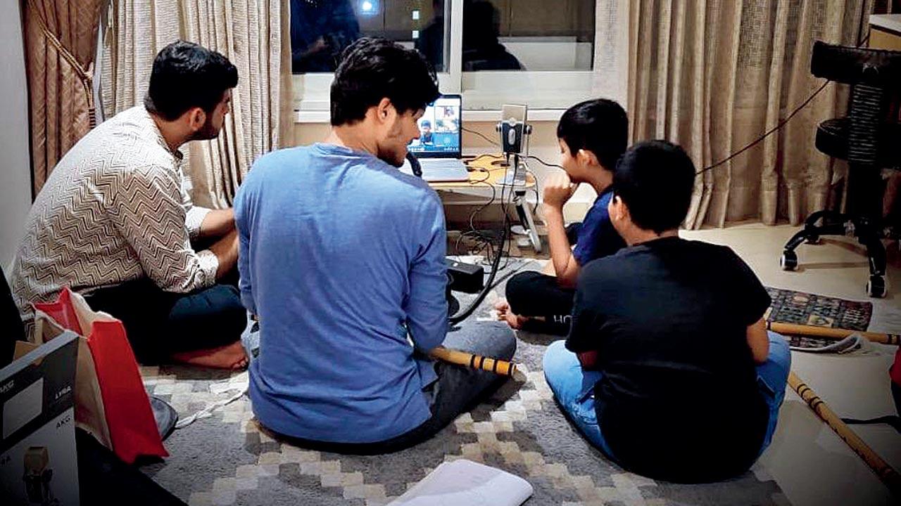 Bhalerao discusses music with his young students	
