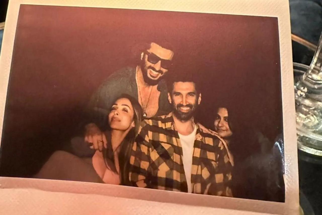 Arjun Kapoor took to his Instagram feed to share pictures from his family night out celebrating 'The Night Manager'. The series stars Anil Kapoor as the antagonist with Aditya Roy Kapur playing the titular character. Arjun also shared a picture with Aditya. Also posing with him are Malaika and Rhea