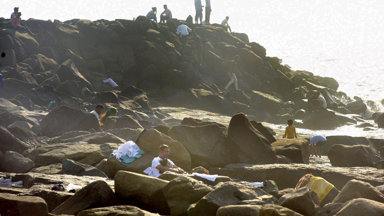 Cops search the rocks near Bandstand, Bandra 