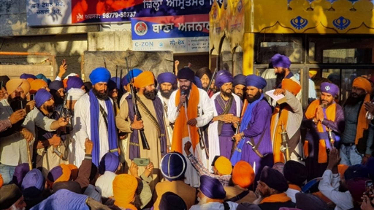 'Waris Punjab De' founder Amritpal Singh along with his supporters arrive at the police station demanding the release of his associate, at Ajnala near Amritsar