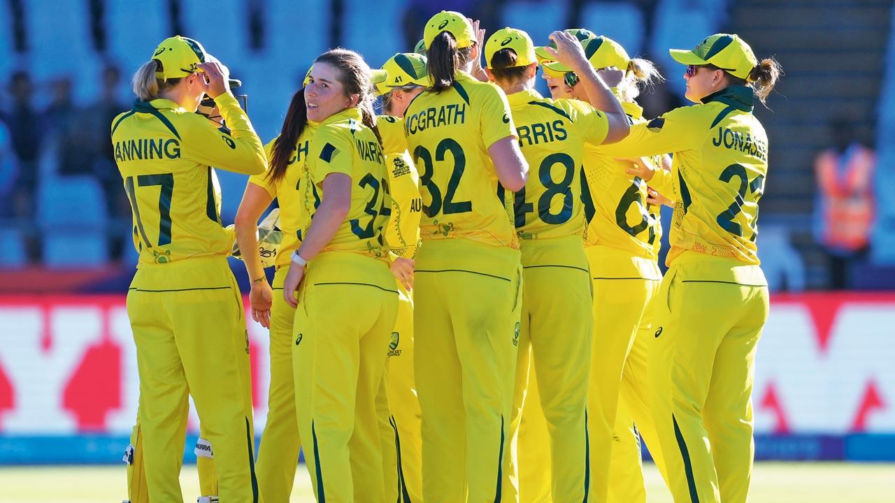 Australia players celebrate the prized wicket of India captain Harmanpreet Kaur in Cape Town yesterday