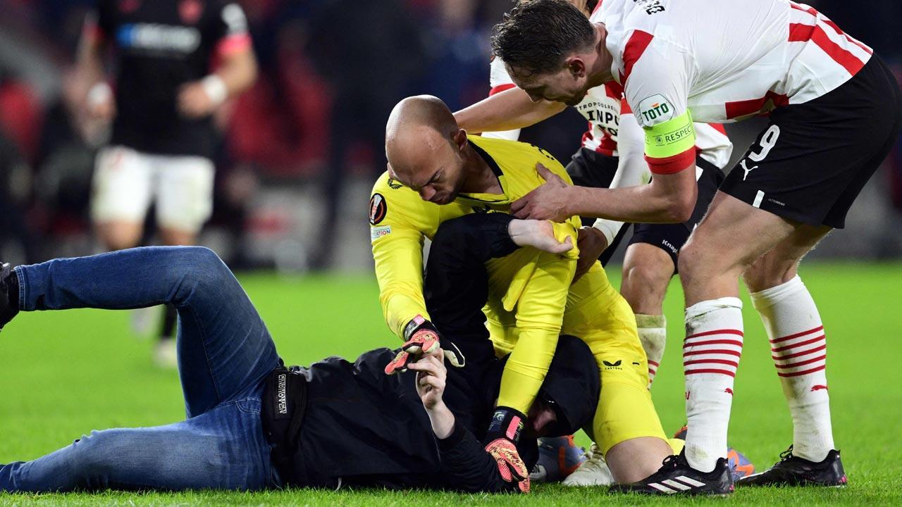 Fan punches Sevilla goalkeeper Marko Dmitrovic