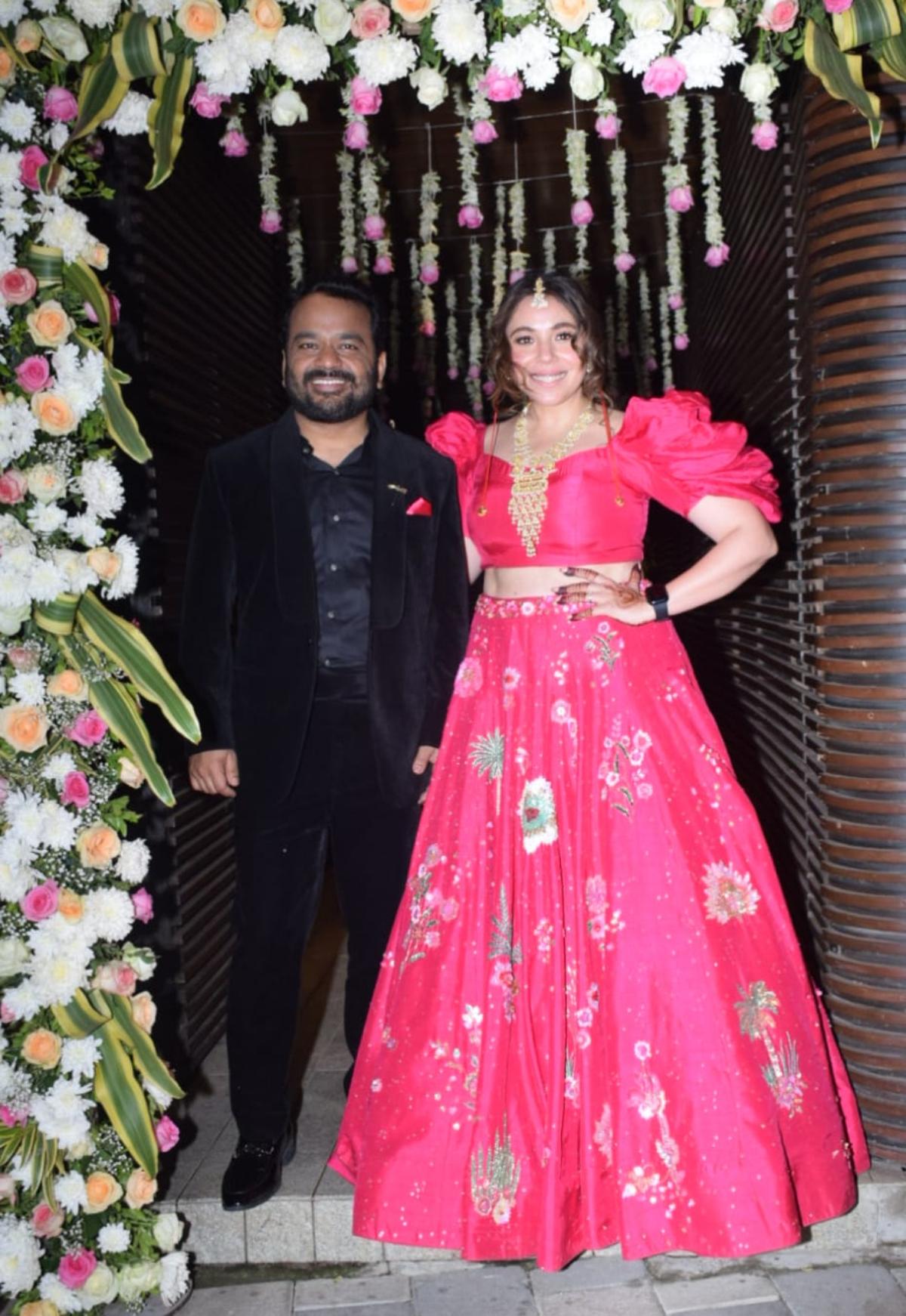 Actor Maanvi Gagroo and stand-up comedian Kumar Varun who walked down the aisle on Thursday, February 23, in front of their family, hosted a post-wedding bash on the same day in the evening for their industry friends. Maanvi looked beautiful as she rocked a magenta-pink cocktail lehenga. Maanvi accessorised her party look with a long gold necklace and a matha-patti. Varun kept it simple with a black suit. The couple were all smiles as they struck a pose together for the shutterbugs who were stationed outside the party venue. 