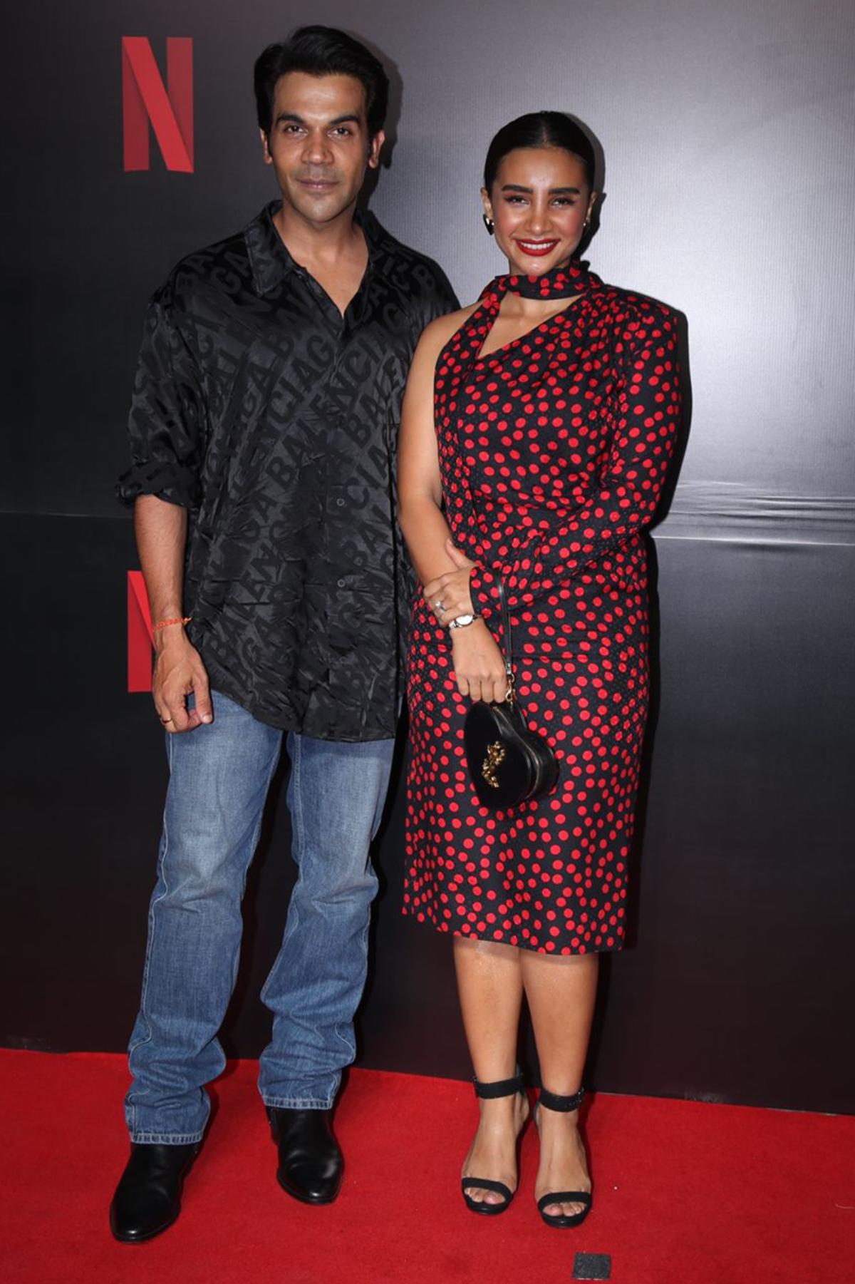 Bollywood's talented couple, Rajkummar Rao and Patralekhaa look happy as they pose together for shutterbugs on the Netflix red carpet. 