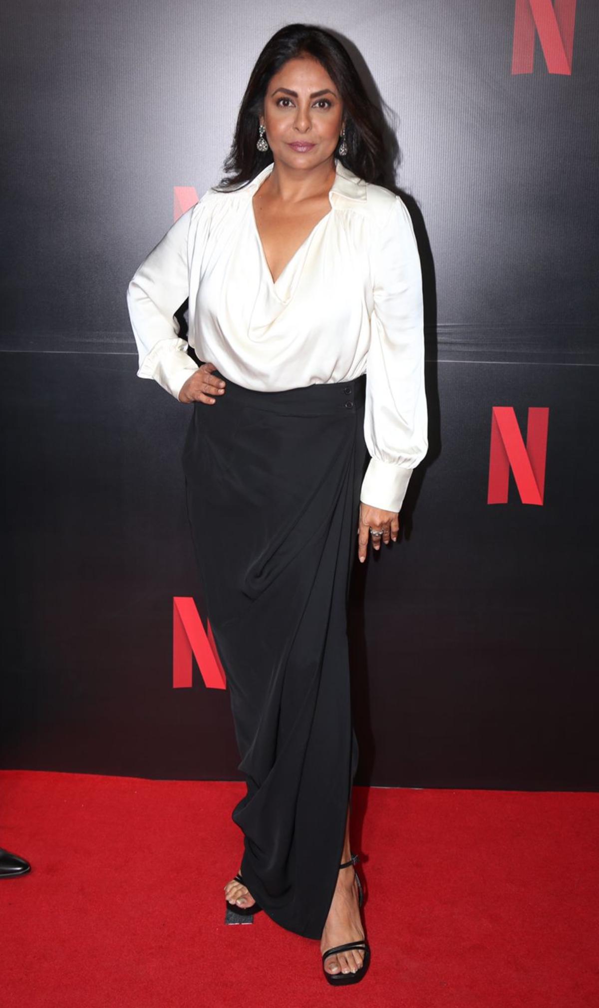 'The Delhi Crime 2' actor, Shefali Shah exudes boss-lady vibes as she graces the red carpet in a spotless deep neck shirt style white top with a chic black skirt. 