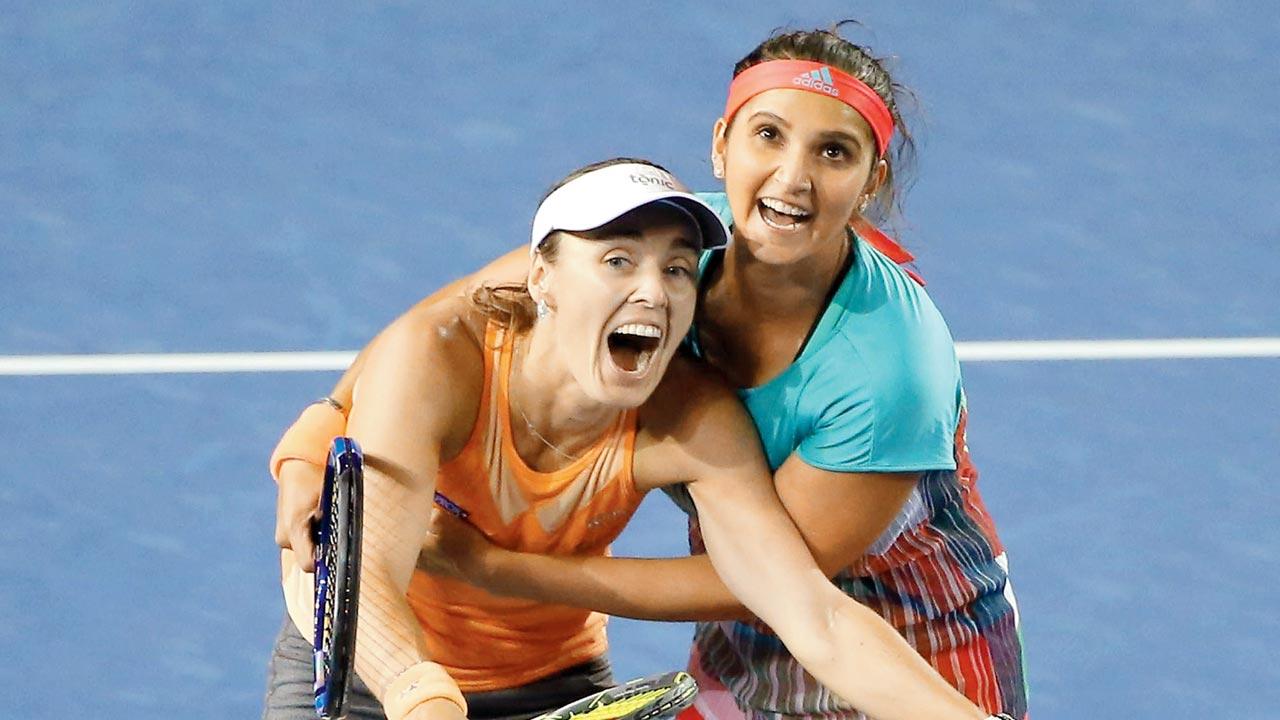 Martina Hingis and Sania Mirza share a happy moment at the 2016 Australian Open. Pic/Getty Images