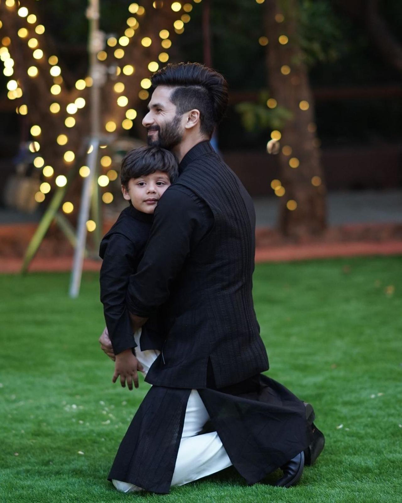 Shahid had shared this beautiful click on him hugging his bundle of joy at his sister Sanah's wedding. Father-son duo also twinned in black-and-white outfit