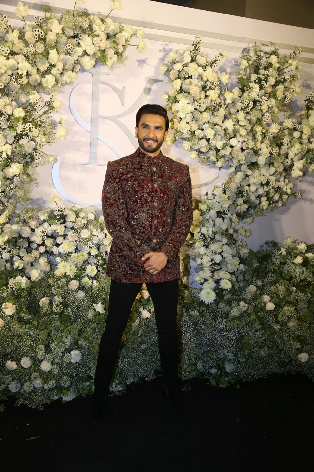 Ranveer Singh arrived solo for the reception. The actor was all smiles dressed in a multi-coloured suit and black pant