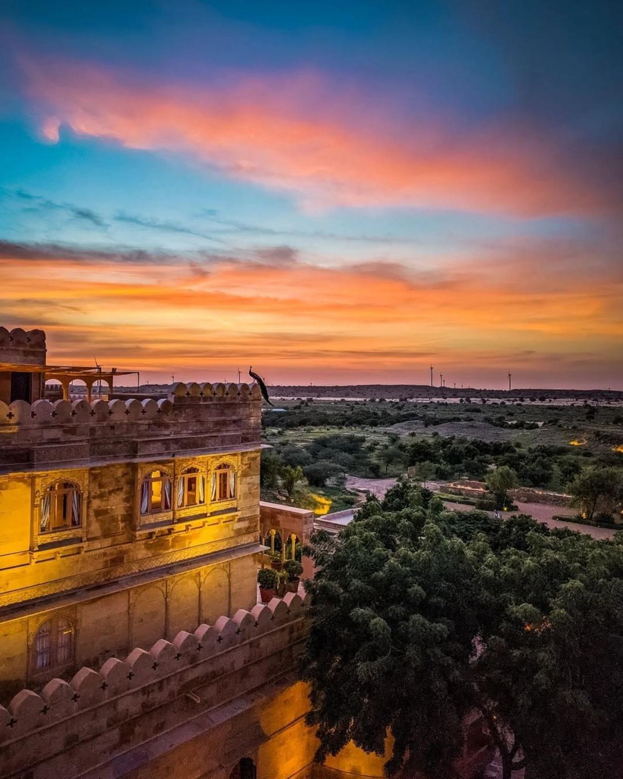 Though built recently, it gives the feel of the 17th century with views of the Thar Desert from its own infinity pool, peacocks for company and each stone of the sandstone edifice handcrafted and hand-chiselled to reflect the indigenous desert culture