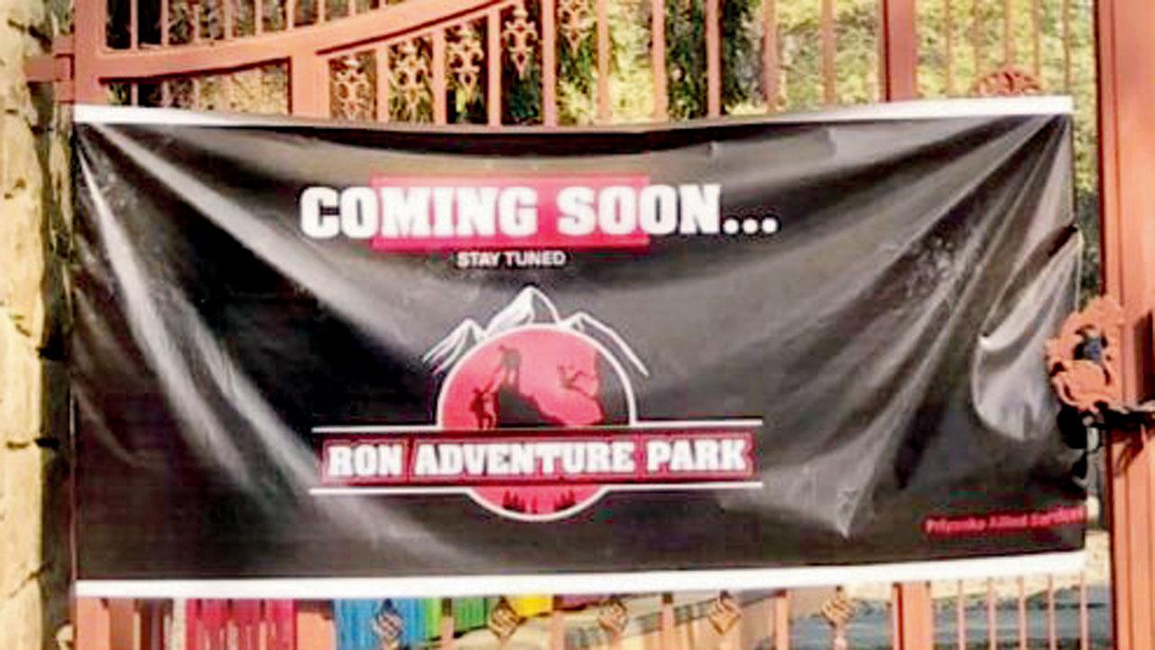 A banner announcing an upcoming adventure park