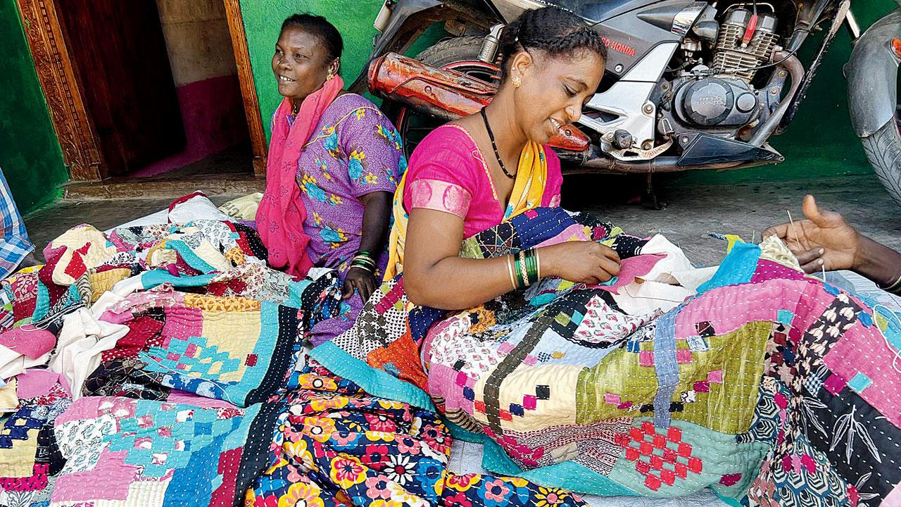 Women from the Siddi community work on their patterned quilts