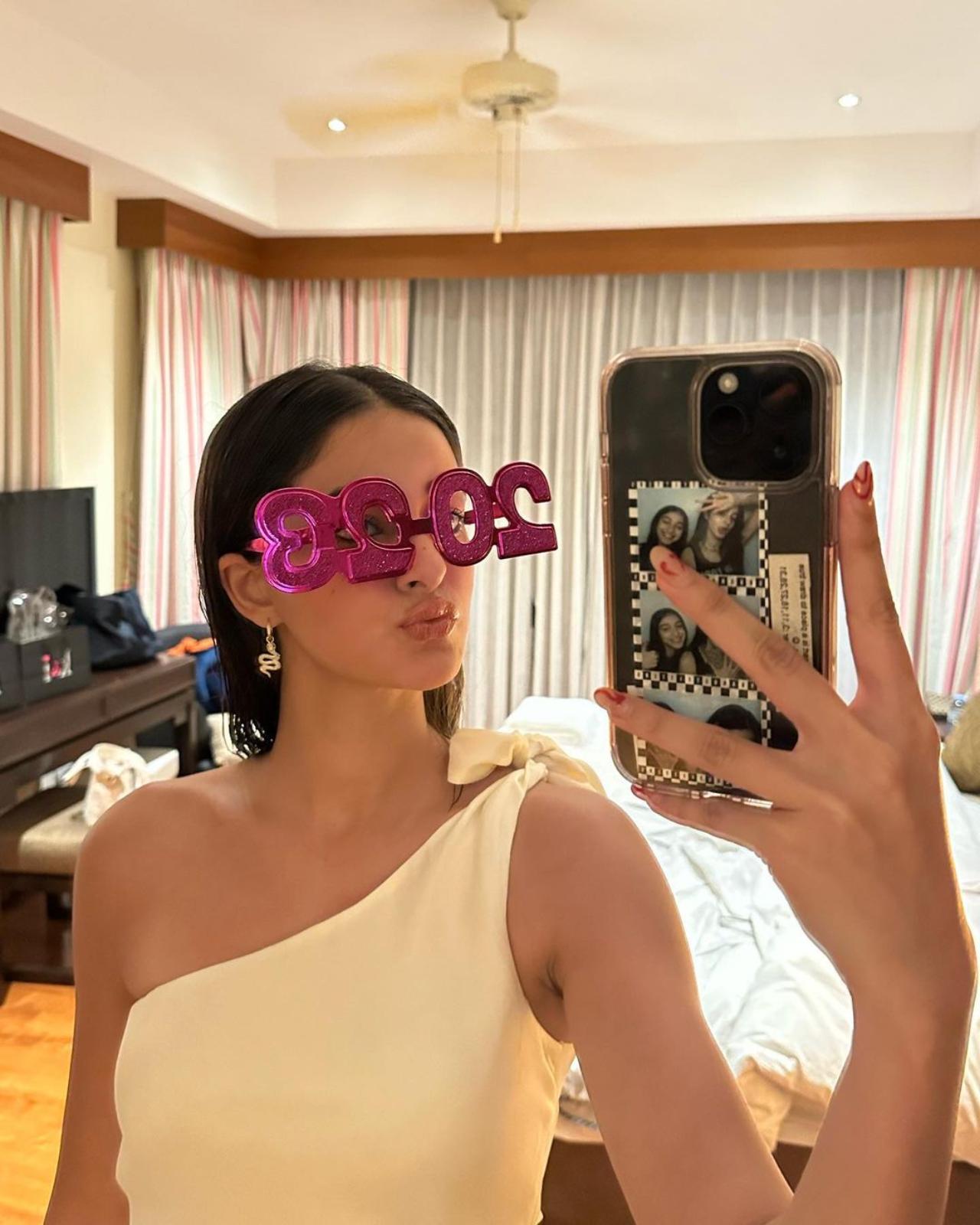 Ananya took to her Instagram handle over the past few days and flooded the gram with her pictures from her time in Thailand. From selfies to the stellar location, Ananya gave a glimpse of it all. 
In the above picture, the actress can be seen wearing glasses shaped to read 2023 and can be seen doing a pout while taking a mirror selfie. 