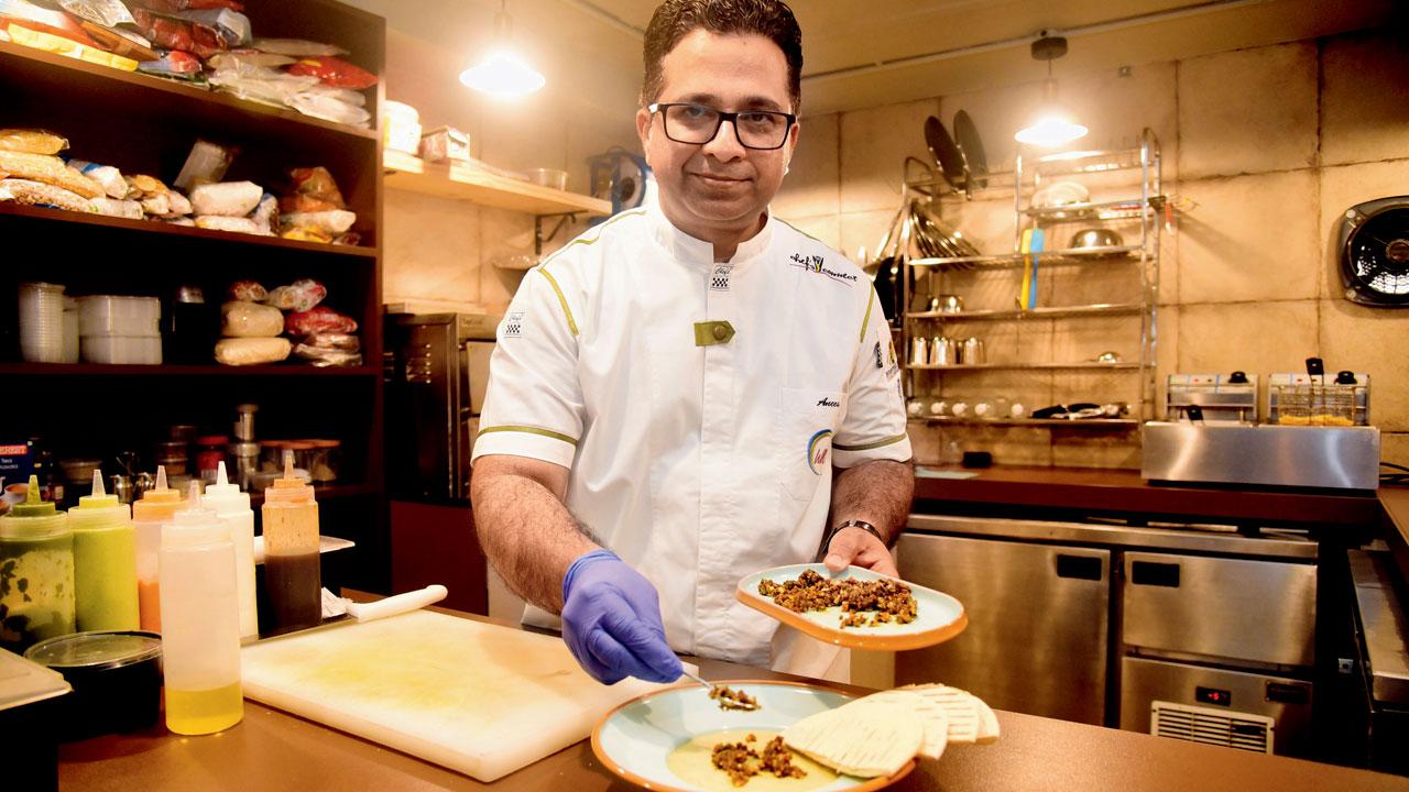 Bambai Cafe by chef Anees Khan takes a new look at Bombay foods. From thecha hummus to papdi chaat, to Bhandup chicken pav,  The dishes are served against a mural of city scenes. Pic/Shadab Khan