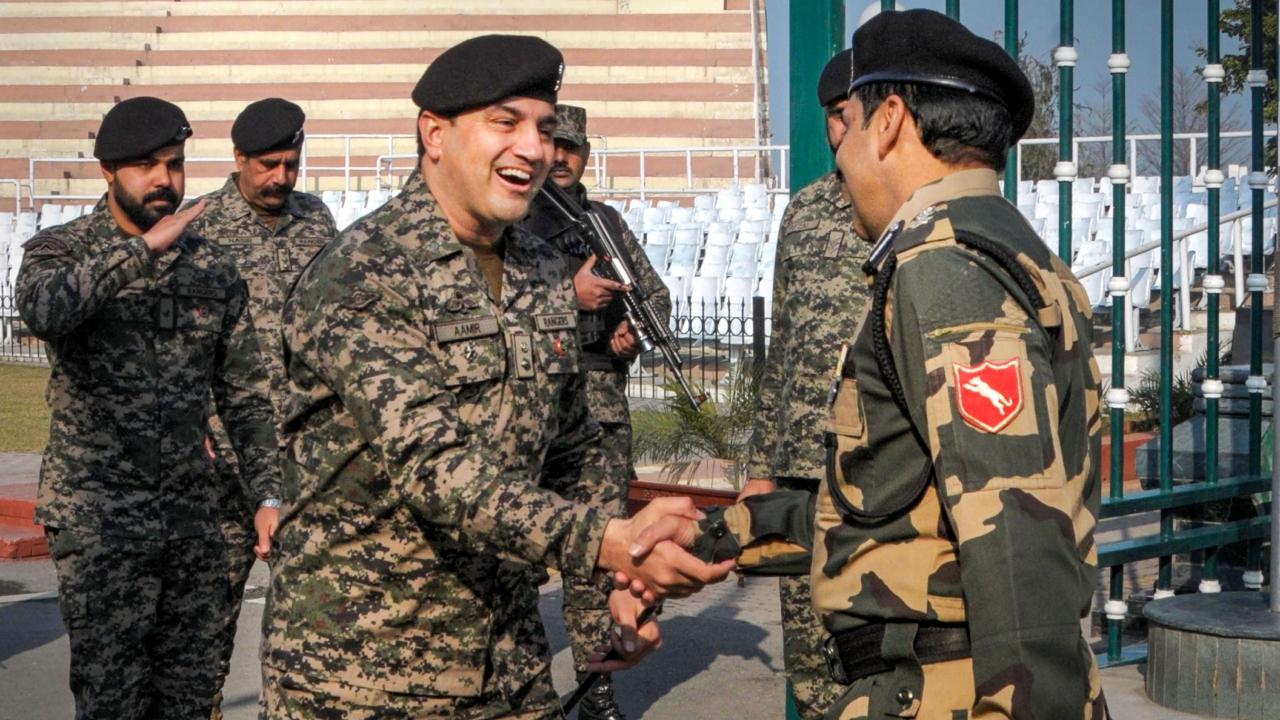 At Attari, Border Security Force's (BSF) Commandant Jasbir Singh and Pakistani Rangers Wing Commander Aamir shook hands on the occasion of India's 74th Republic Day at the Attari-Wagah border, about 35 km from Amritsar