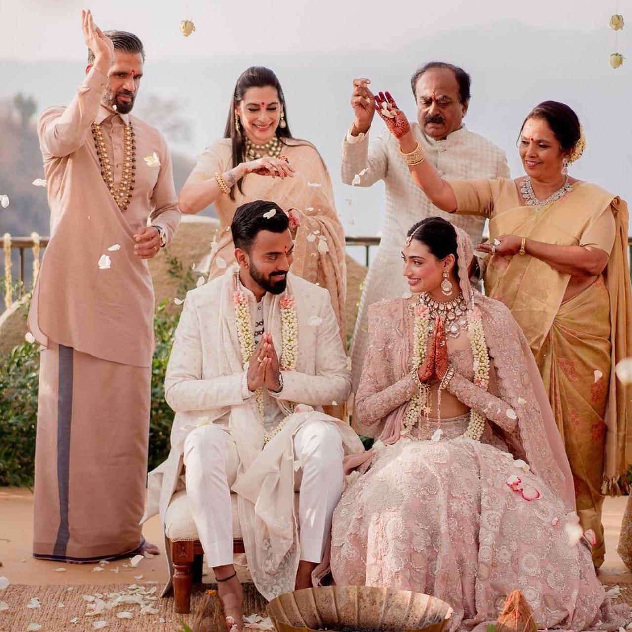 For the wedding, Athiya looked resplendent in an old-rose pink lehenga and her groom cricketer KL Rahul complemented her look in an ivory sherwani, as the star couple tied the knot at Suniel Shetty's bungalow in Khandala