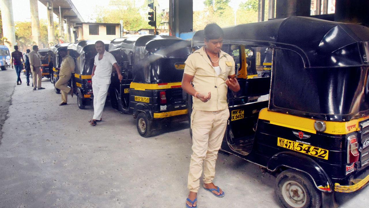 Auto drivers wait outside Gundavli station on Monday. Pic/Sameer Markande
