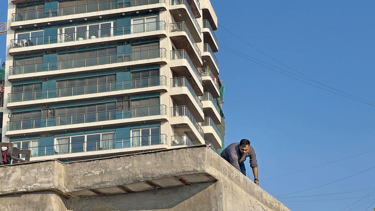 Crime Branch officers at the terrace of another accused Abdul Jabbar Ansari’s residence on Thursday