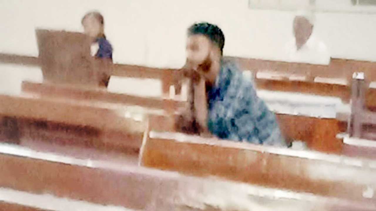 The accused captured on CCTV camera during the prayer service