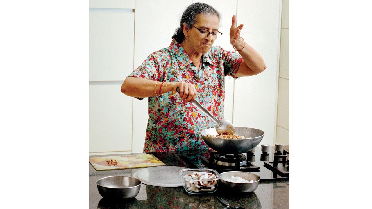 Talati’s aunt Dinaz in the kitchen of her Gandhidham residence making coconut and tamarind fish curry