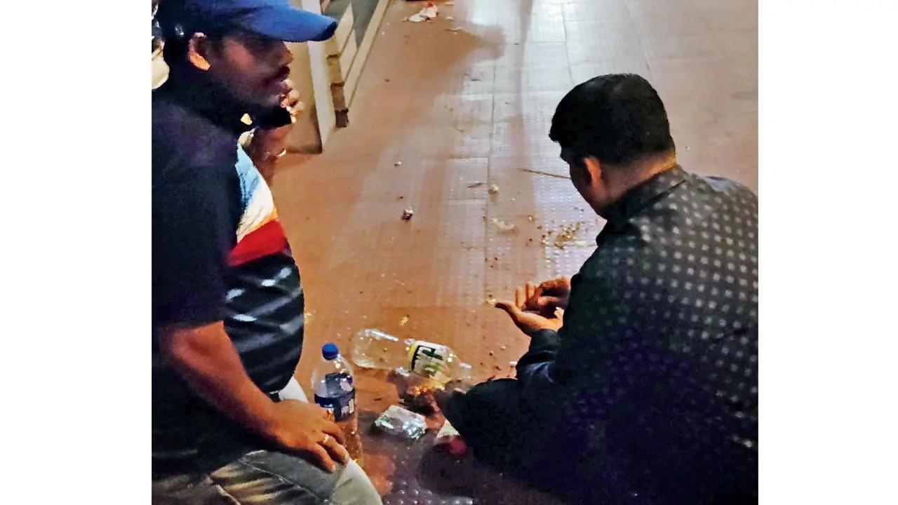 Liquor is openly consumed on the footpath outside Asiatic Dept Store outside Churchgate station, on Sunday