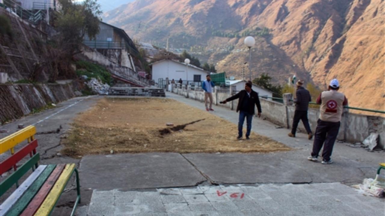 Cracks appear on the road due to landslides at Vishnupuram Marwari Colony, in the Joshimath. The chief minister will visit Joshimath on Saturday, meet the affected people and hold a meeting with officials